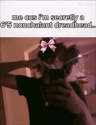 Person Taking Selfie With Bow On Head GIF