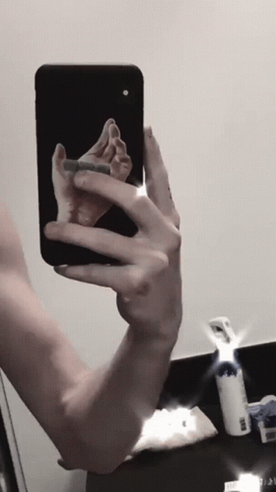 Person Taking Selfie With Phone GIF