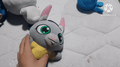 Person Touching Stuffed Animal With Yellow Shirt GIF