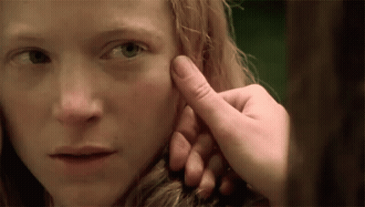 Person Touching Woman's Face With Finger GIF