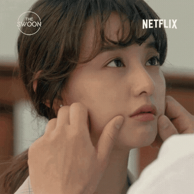 Person Touching Woman's Face With Netflix Logo Background GIF