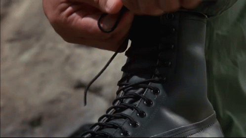 Person Tying A Boot GIF