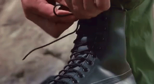 Person Tying Boots Close Up GIF
