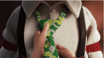 Person Tying Green And White Tie GIF