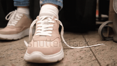 Person Tying Shoe Laces With Shutterstock GIF