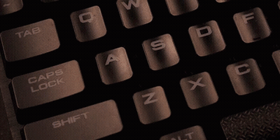 Person Typing On Keyboard With Caps Lock Highlighted GIF