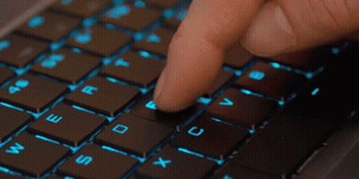 Person Typing On Keyboard With Finger On Shift Key GIF