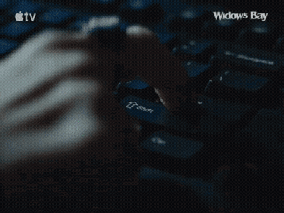 Person Typing On Keyboard With Widows Bay GIF