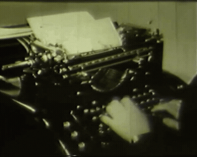 Person Typing On Old Typewriter With Paper GIF