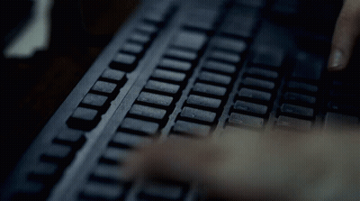 Person Typing T And L On Keyboard GIF