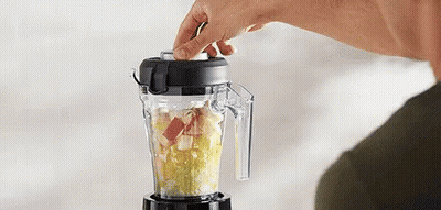Person Using Blender To Make Smoothie With Fruit GIF