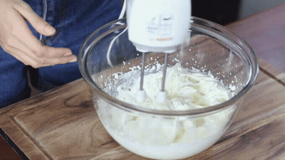 Person Using Bosch Mixer To Whip Cream GIF
