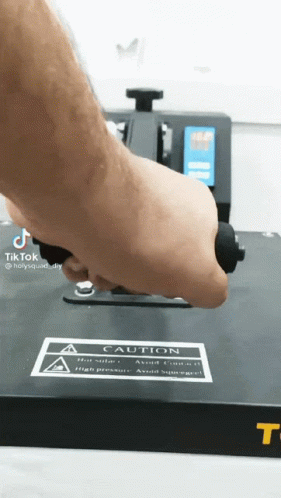 Person Using Machine With Caution Sign GIF