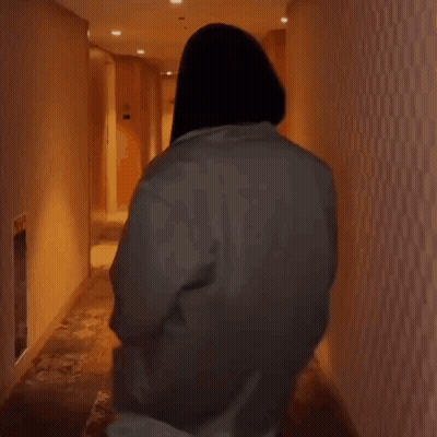 Person Walking Down Hallway GIF