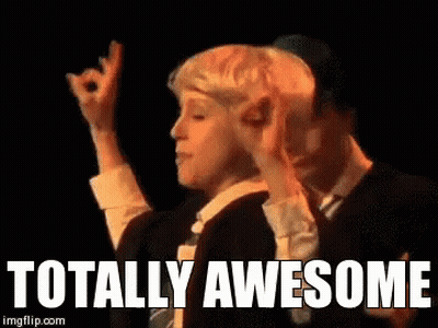 Person Walking Down Hospital Hallway With Exit Sign GIF