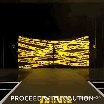 Person Walking Down Runway With Yellow Caution Tape GIF