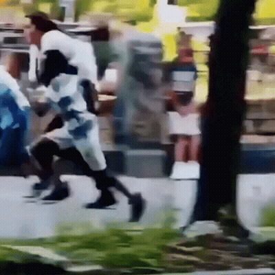 Person Walking Down Street GIF
