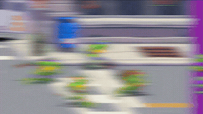 Person Walking Down Street GIF