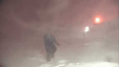 Person Walking Foggy Street At Night GIF