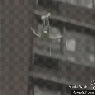 Person Walking In Front Of House GIF