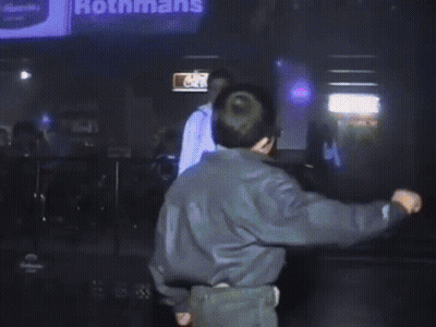 Person Walking In Front Of McDonalds Sign GIF