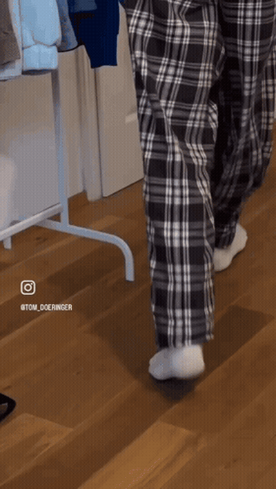Person Walking In Plaid Pajama Pants And White Socks GIF