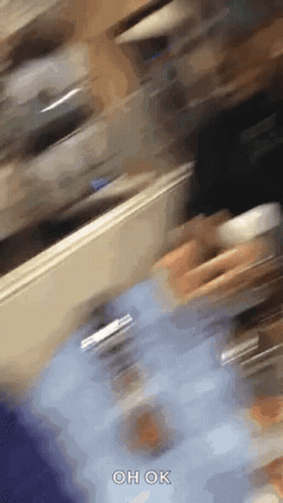Person Walking In Room With Oh Ok GIF