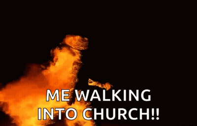 Person Walking Into Church With Flames GIF