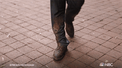 Person Walking On Brick Sidewalk With NBC GIF