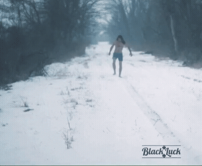 Person Walking On Snowy Road Black Luck GIF