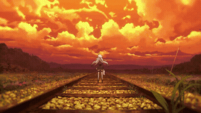 Person Walking On Tracks At Sunset GIF