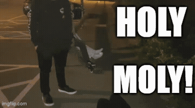 Person Walking Past Holy Moly Sign GIF