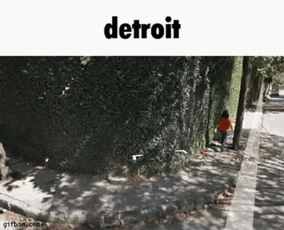Person Walking Sidewalk Next To Tree GIF