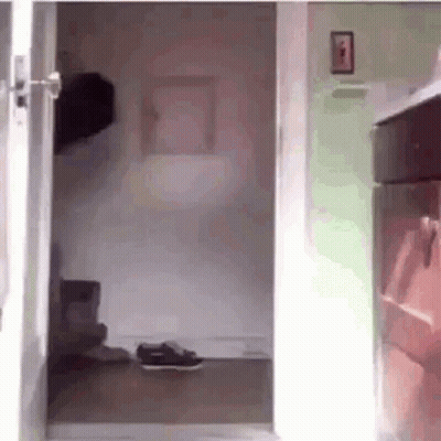 Person Walking Through Doorway GIF