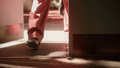 Person Walking Through Doorway GIF