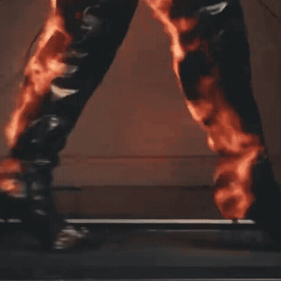 Person Walking Treadmill With Flames GIF