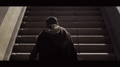 Person Walking Up Stairs From Behind GIF