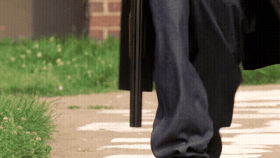 Person Walking With Gun In Pocket GIF