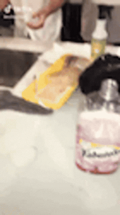 Person Washing Dishes In Kitchen Sink GIF