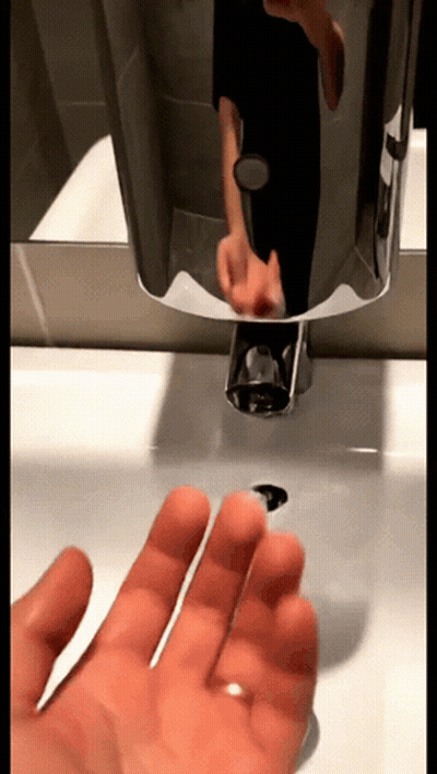 Person Washing Hands In Bathroom GIF