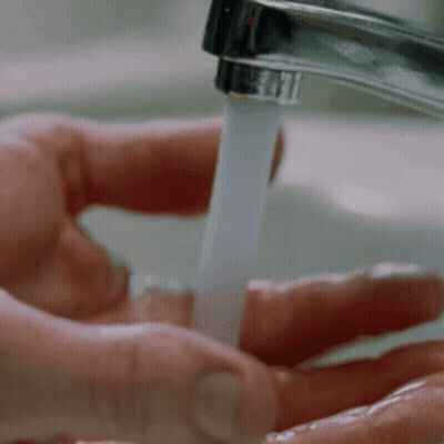 Person Washing Hands In Sink GIF