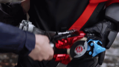 Person Wearing Belt With Red And Blue Emblem Saying AA GIF