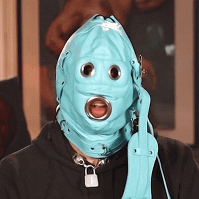 Person Wearing Blue Mask With Eye Holes GIF