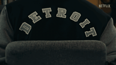 Person Wearing Detroit Varsity Jacket With Netflix Logo GIF