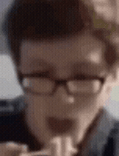 Person Wearing Glasses Eating Hamburger GIF