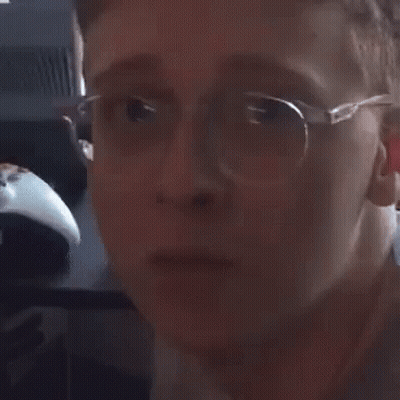 Person Wearing Glasses Making A Face GIF