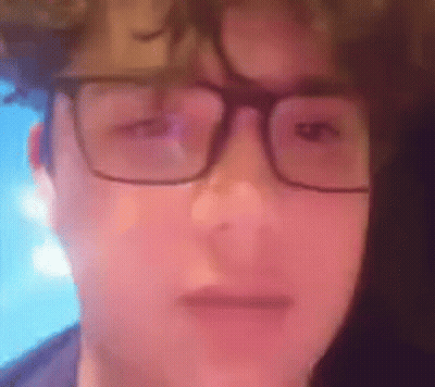 Person Wearing Glasses Making A Face GIF