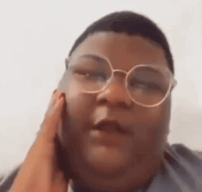 Person Wearing Glasses Talking On Cell Phone GIF