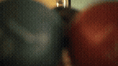 Person Wearing Glasses With Red Bowling Ball GIF