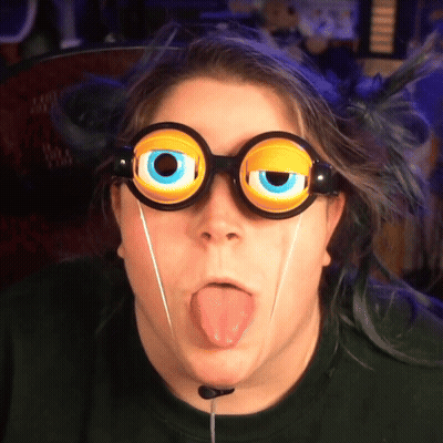 Person Wearing Goggles With Big Eyes Sticking Out Tongue